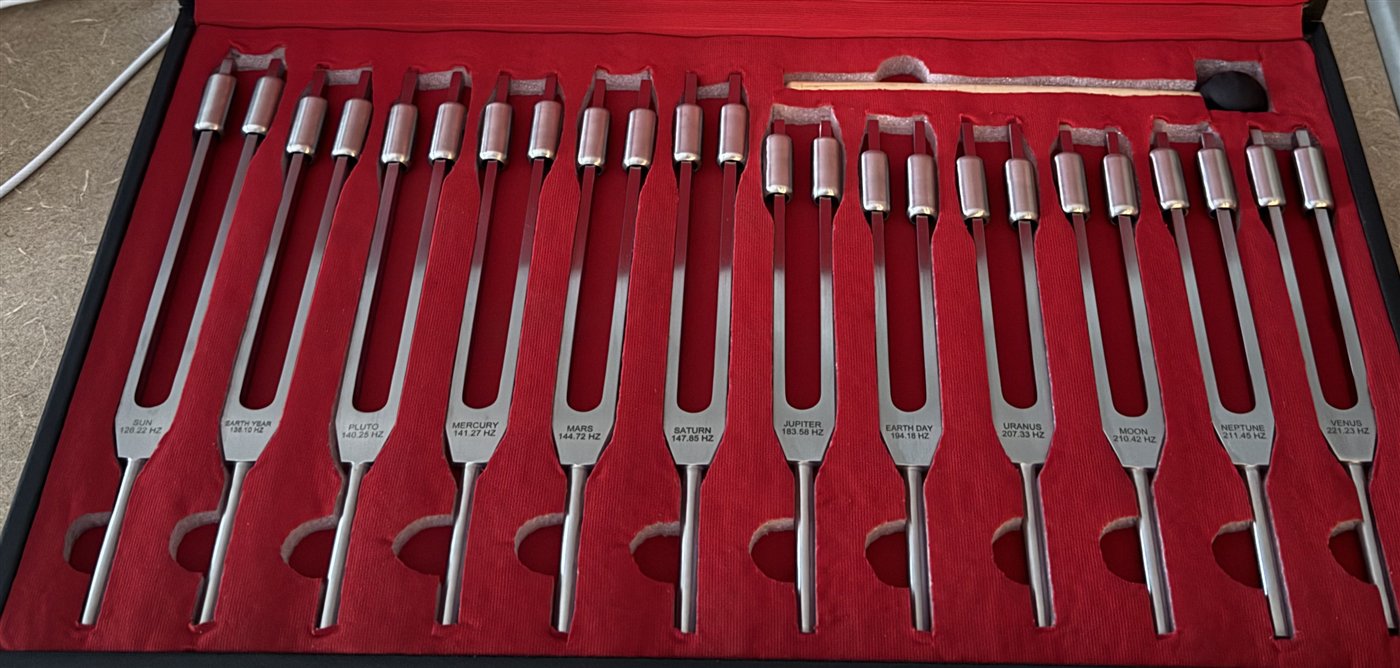 The twelve-piece weighted Sacred Tones set, weights visible at the tines.